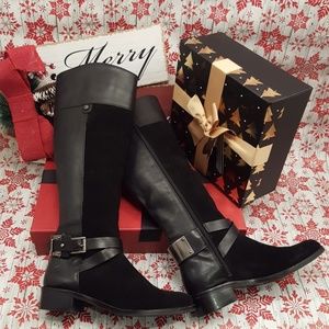 Vince Camuto Riding Boot
Size 6
Black Leather w/ Stylish Strap